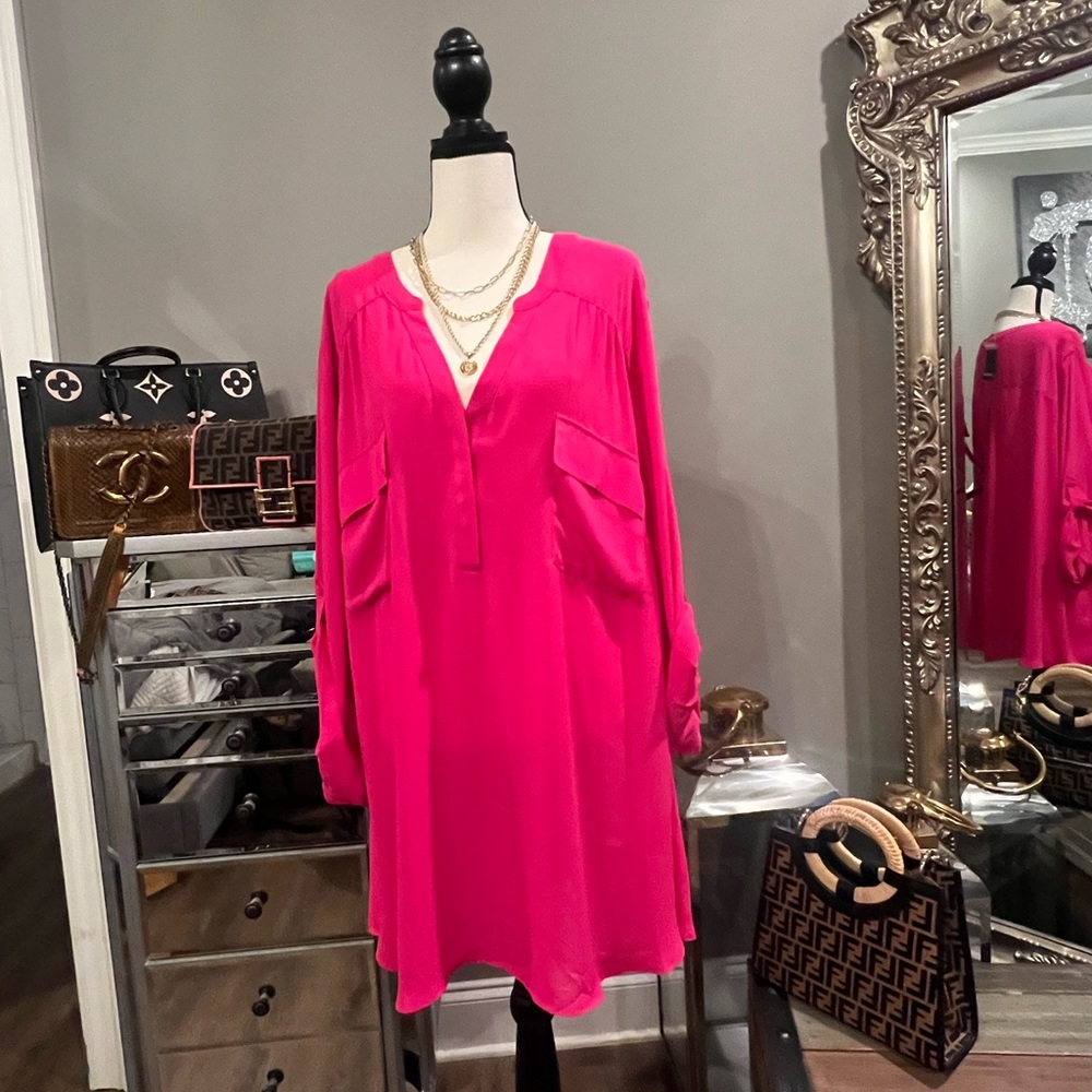The hottest color out there. This pink blouse had pockets on the chest.